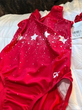 GK Red Girls' One-Piece Gym Suit with White Starburst Print with hair tie